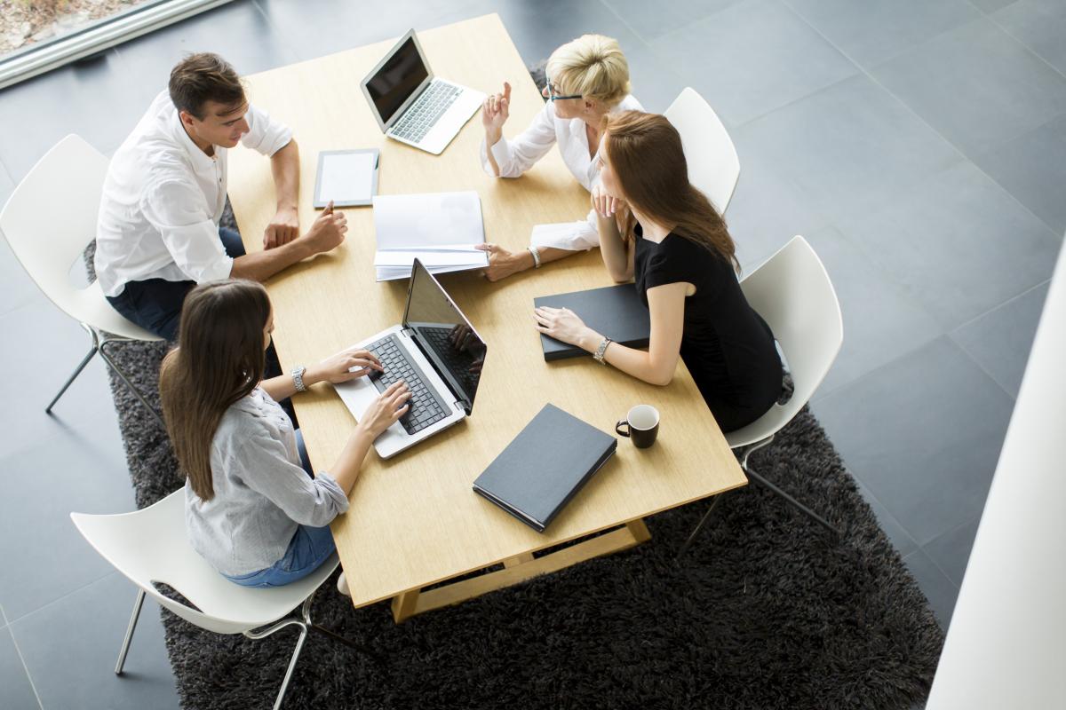 people talking at a table