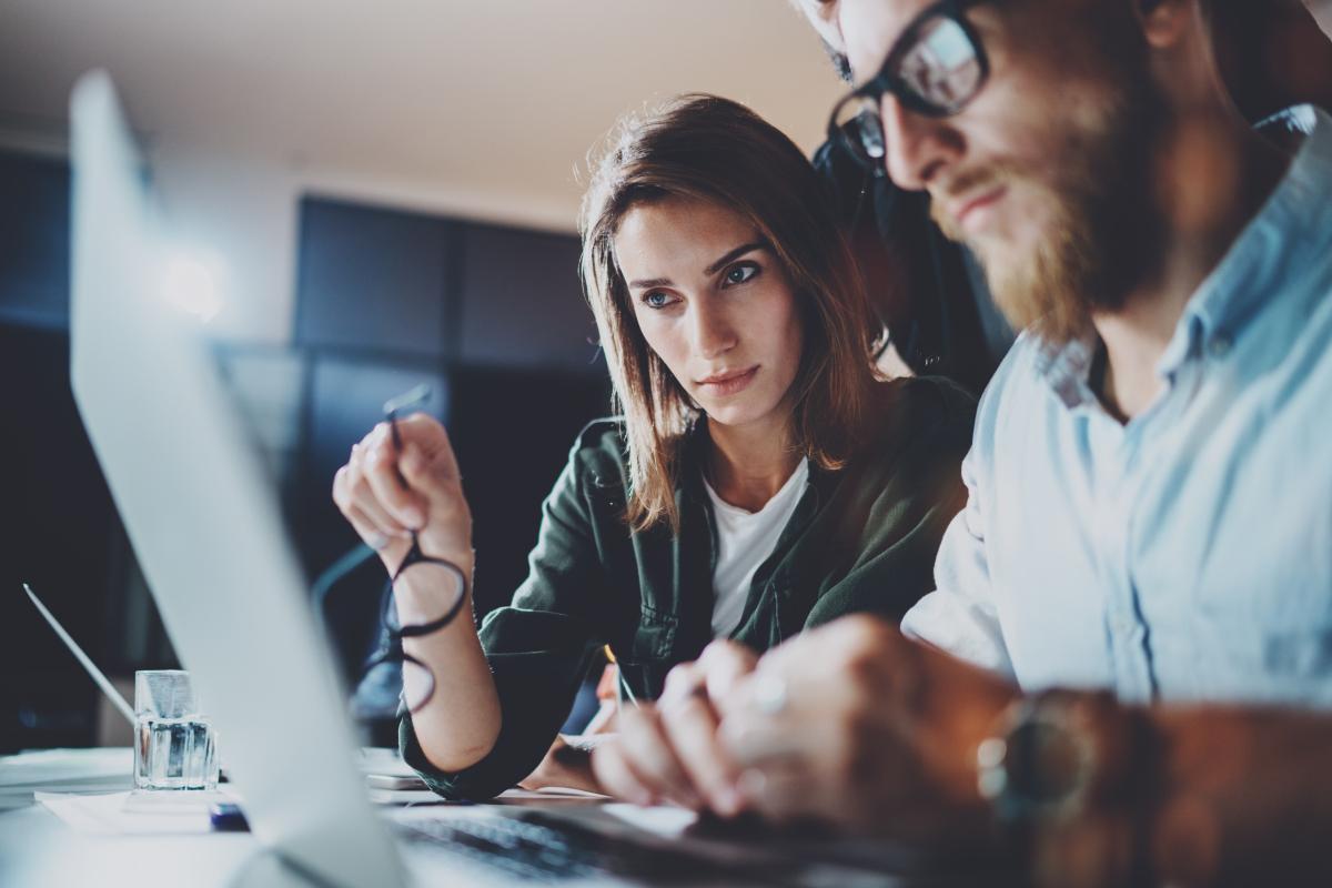 two people looking at a computer