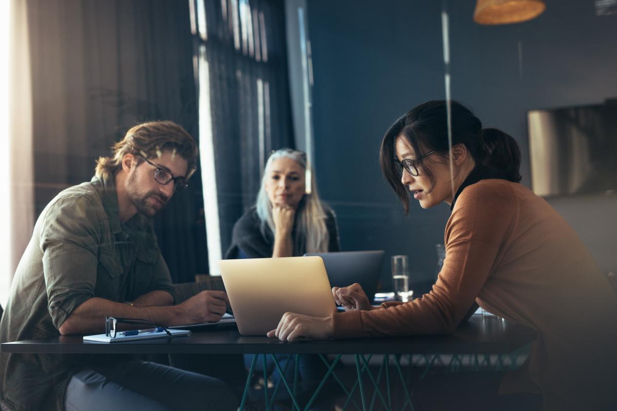 people looking at a computer